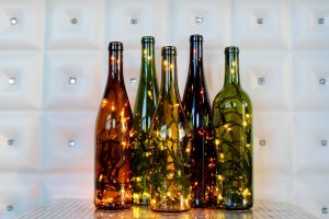 Fill-wine-bottles-with-lights-to-make-a-spectacular-centerpiece